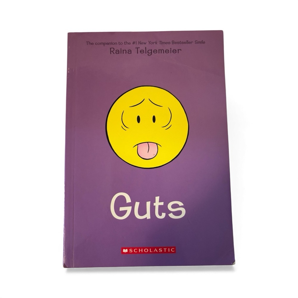 Scholastic Guts By Raina Telgemeier Book with Purple and Yellow Cover